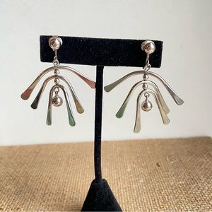 Avon clip on spinner earrings in shiny  silvertone with balls and curved bars